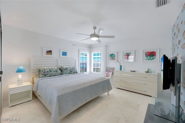 bedroom with visible vents and a ceiling fan