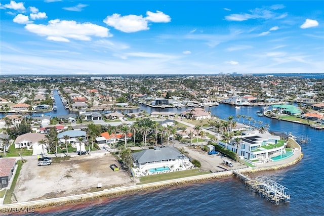 drone / aerial view featuring a water view and a residential view