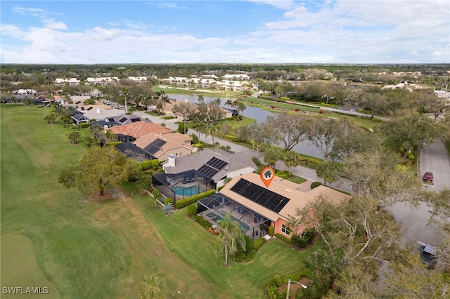 bird's eye view featuring a water view and a residential view