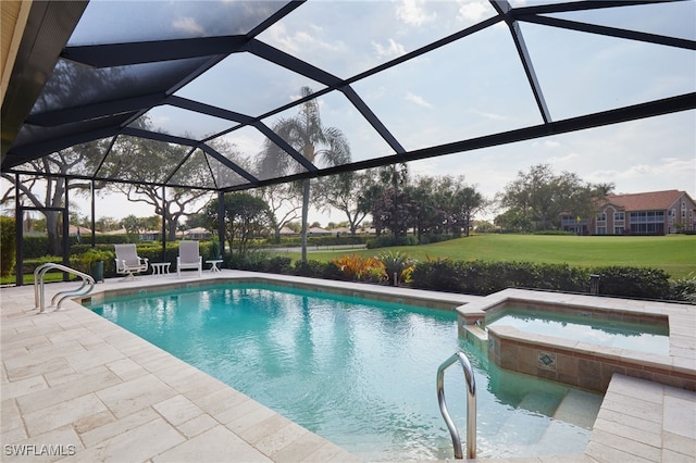 view of pool featuring a lanai, a patio area, and a pool with connected hot tub