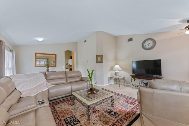15773 Beachcomber Ave, Fort Myers, FL 33908 - living area with arched walkways, lofted ceiling, visible vents, a ceiling fan, and baseboards