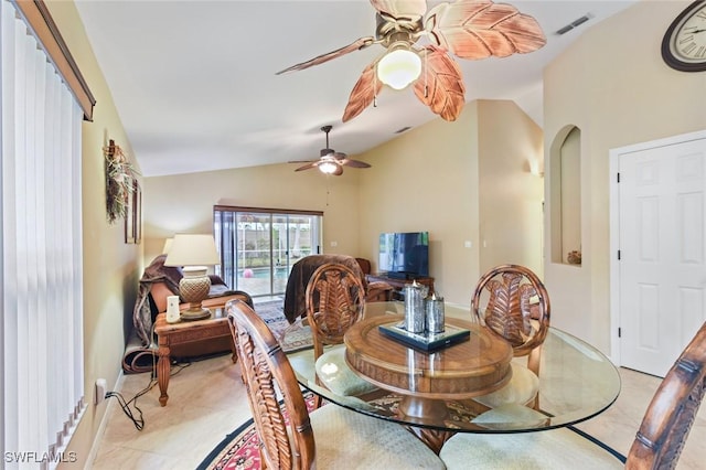 15773 Beachcomber Ave, Fort Myers, FL 33908 - dining area with arched walkways, light tile patterned floors, visible vents, ceiling fan, and vaulted ceiling