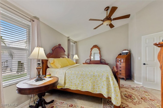 15773 Beachcomber Ave, Fort Myers, FL 33908 - bedroom with light tile patterned floors, multiple windows, baseboards, and vaulted ceiling