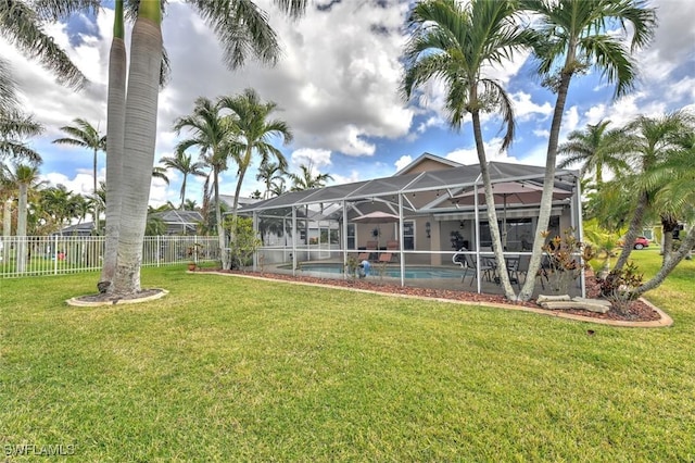 15773 Beachcomber Ave, Fort Myers, FL 33908 - view of yard featuring a lanai, fence, and a fenced in pool