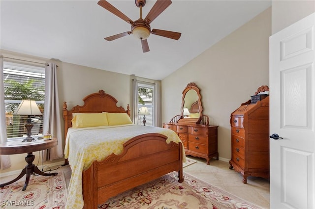 15773 Beachcomber Ave, Fort Myers, FL 33908 - bedroom featuring light tile patterned floors, ceiling fan, baseboards, and vaulted ceiling