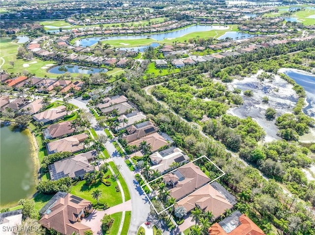 birds eye view of property featuring a residential view and a water view