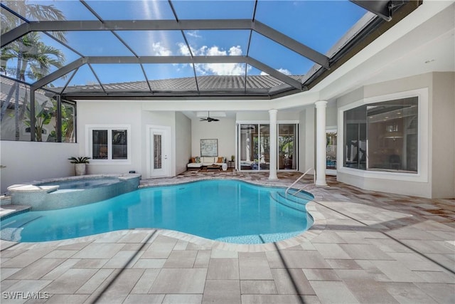 view of pool with a pool with connected hot tub, a patio, and ceiling fan