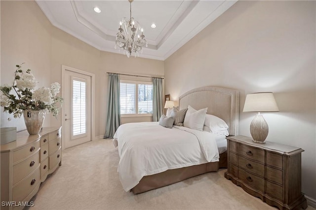 bedroom featuring access to exterior, a raised ceiling, an inviting chandelier, ornamental molding, and light carpet