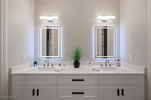 full bath featuring double vanity and a sink