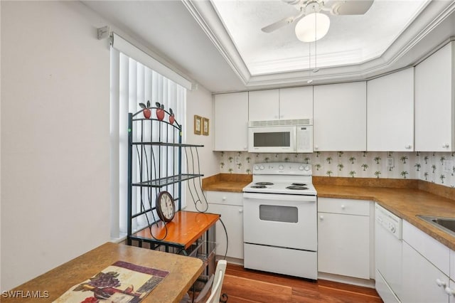 kitchen with white appliances, ceiling fan, white cabinets, and dark wood finished floors