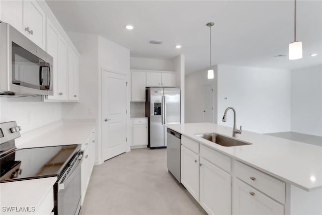 kitchen featuring recessed lighting, visible vents, appliances with stainless steel finishes, white cabinetry, and a sink