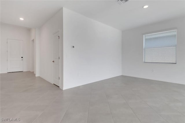 empty room with visible vents and recessed lighting