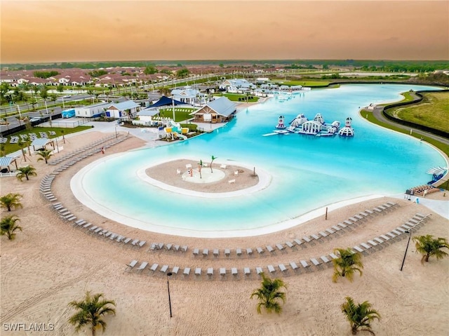 view of swimming pool with a water view