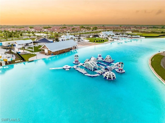 aerial view at dusk with a water view