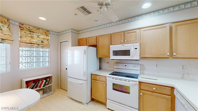 kitchen featuring white appliances, visible vents, decorative backsplash, light countertops, and light floors