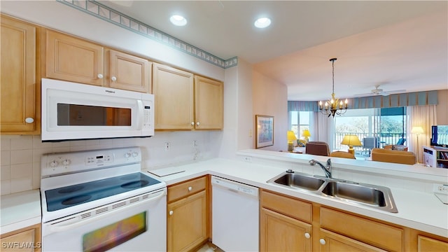 kitchen with a sink, light brown cabinetry, white appliances, and light countertops