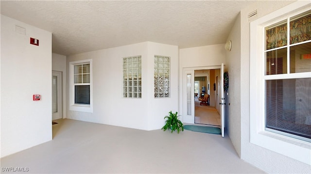 property entrance featuring stucco siding