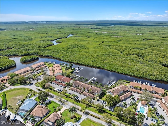 drone / aerial view with a water view and a residential view