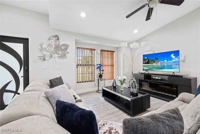 living room with light wood finished floors, ceiling fan, baseboards, and recessed lighting