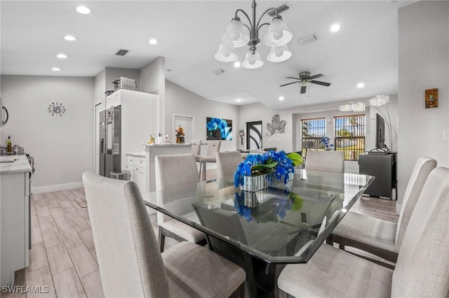 dining space with recessed lighting, visible vents, baseboards, wood tiled floor, and ceiling fan with notable chandelier