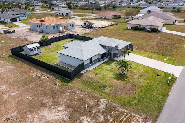 birds eye view of property with a residential view