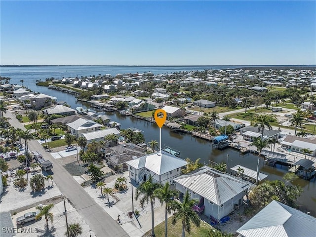 bird's eye view featuring a residential view and a water view