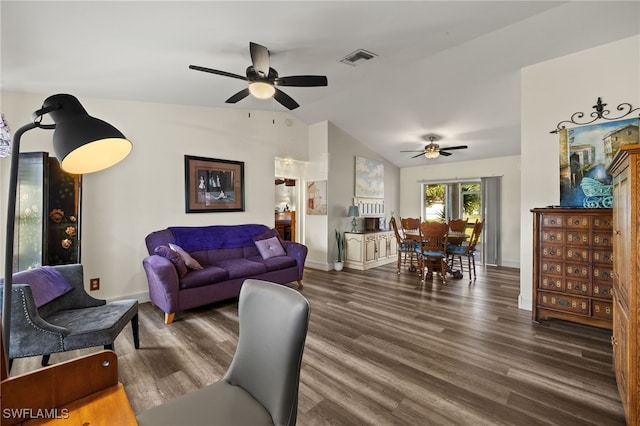 living area featuring lofted ceiling, dark wood-style floors, baseboards, and visible vents