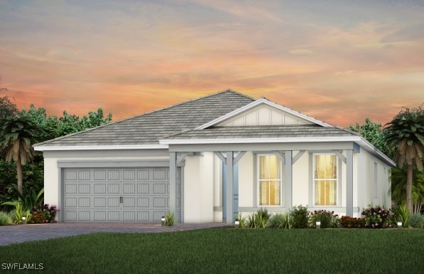 ranch-style home with an attached garage, driveway, a front lawn, and stucco siding