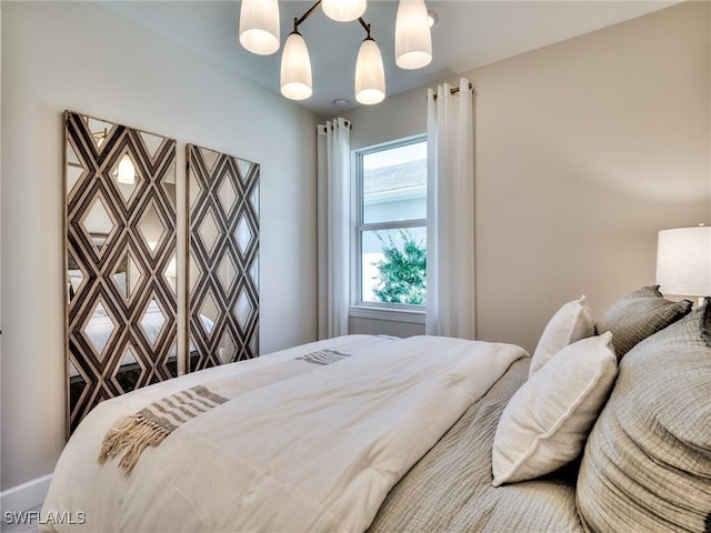 bedroom with a chandelier