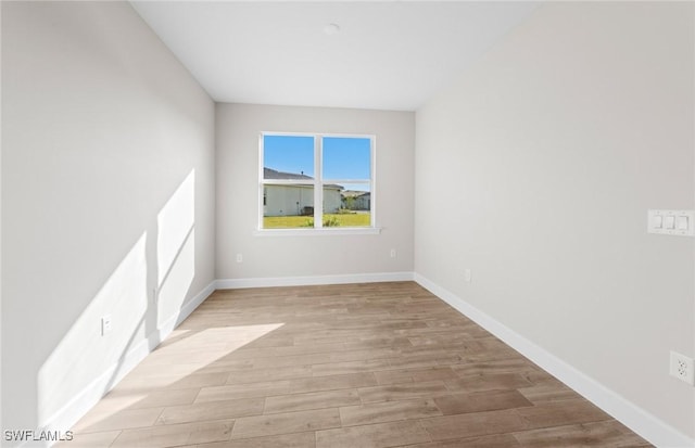 17333 Leaning Oak Trl, North Fort Myers, FL 33917 - unfurnished room with light wood-type flooring and baseboards