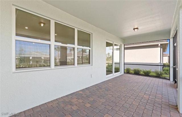 17333 Leaning Oak Trl, North Fort Myers, FL 33917 - unfurnished sunroom featuring brick patterned flooring