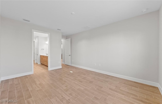 17333 Leaning Oak Trl, North Fort Myers, FL 33917 - empty room featuring light wood-type flooring and baseboards