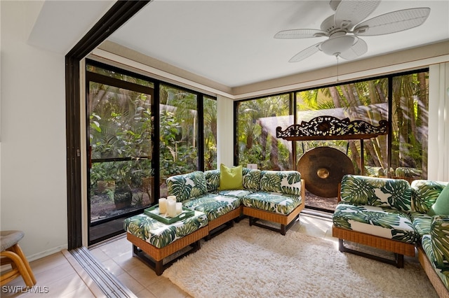 sunroom / solarium featuring ceiling fan