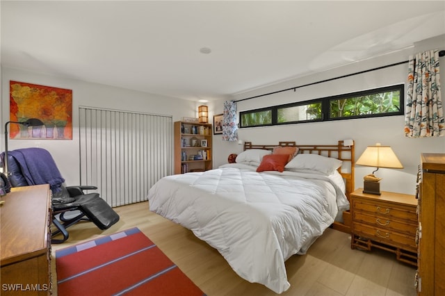 bedroom featuring light wood-style flooring