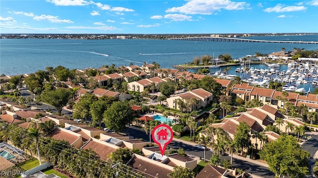 birds eye view of property featuring a water view and a residential view