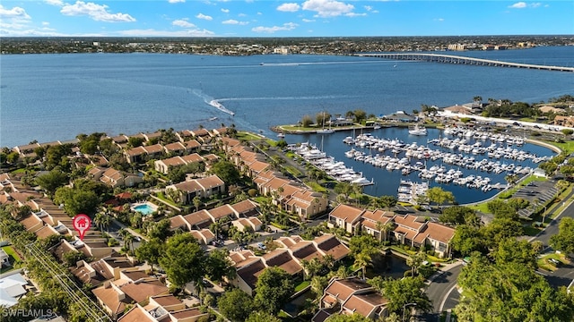 drone / aerial view featuring a water view and a residential view