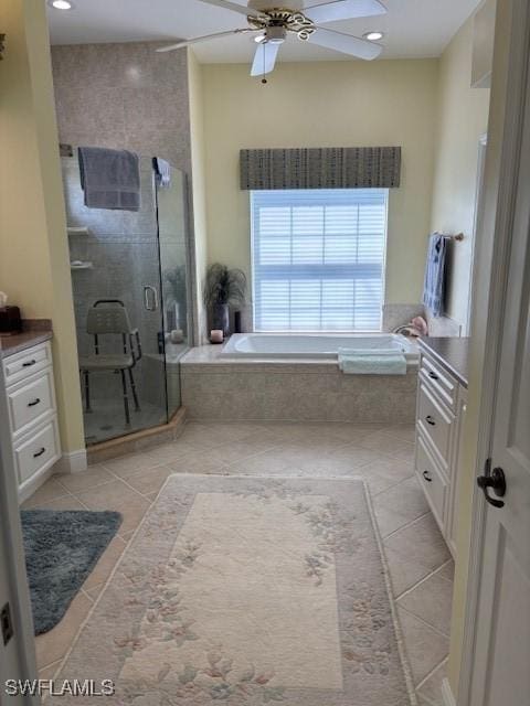 full bath with tile patterned flooring, a shower stall, recessed lighting, a bath, and a ceiling fan