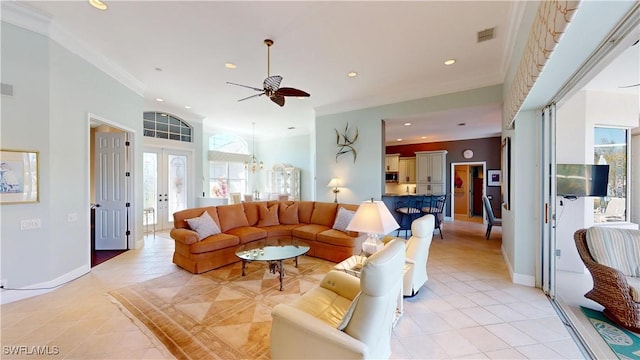living area featuring recessed lighting, visible vents, light tile patterned flooring, and ceiling fan with notable chandelier