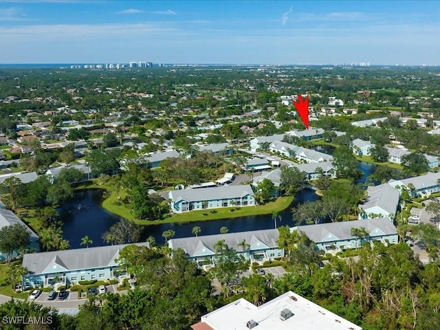 bird's eye view featuring a water view and a residential view