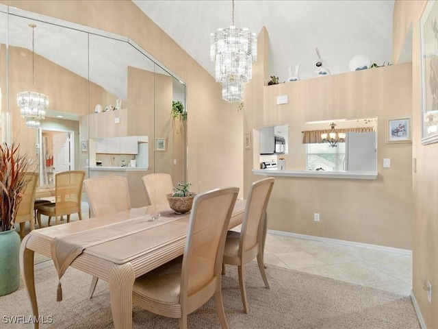 dining space featuring light tile patterned floors, baseboards, high vaulted ceiling, and a notable chandelier