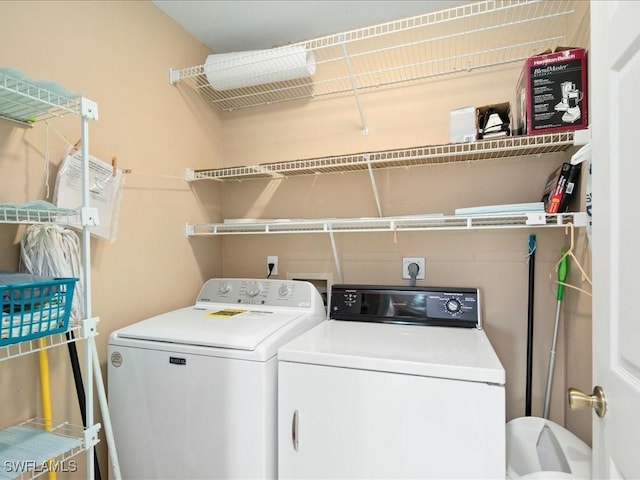 clothes washing area featuring laundry area and independent washer and dryer