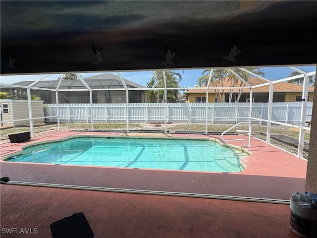 view of pool with a fenced in pool, a patio area, a lanai, and a fenced backyard