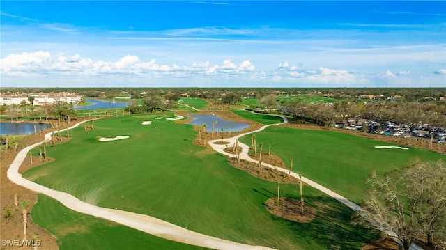 drone / aerial view featuring a water view and view of golf course