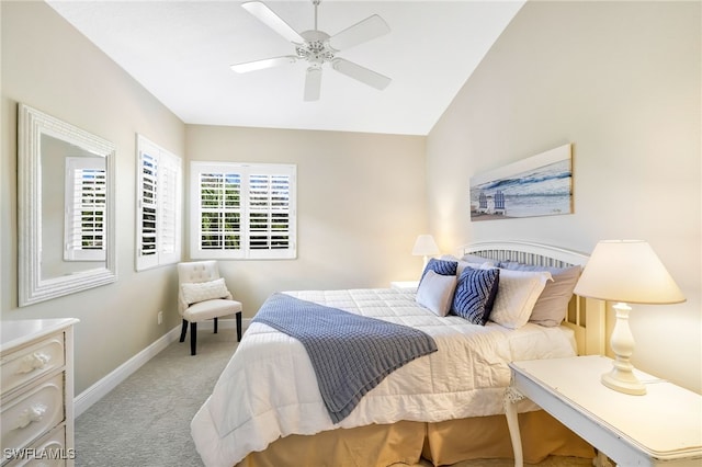 bedroom featuring lofted ceiling, light carpet, ceiling fan, and baseboards