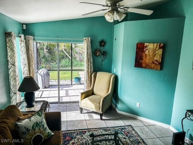 sitting room featuring light tile patterned floors, ceiling fan, and baseboards