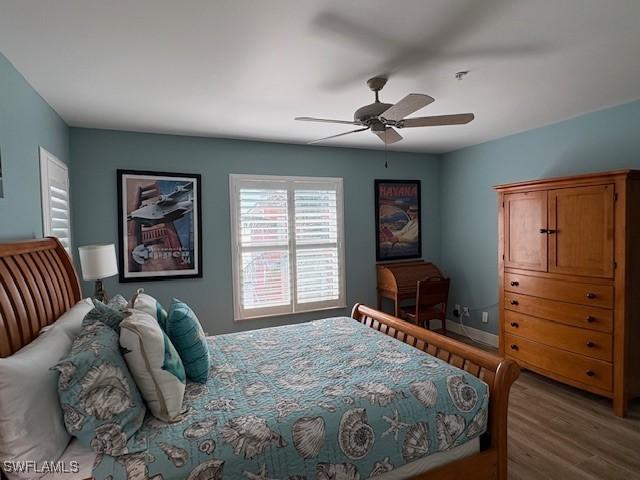 bedroom with wood finished floors and ceiling fan