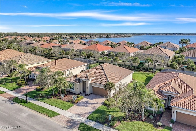 bird's eye view featuring a water view and a residential view