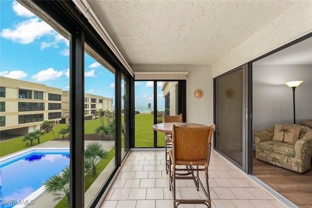 balcony featuring a sunroom