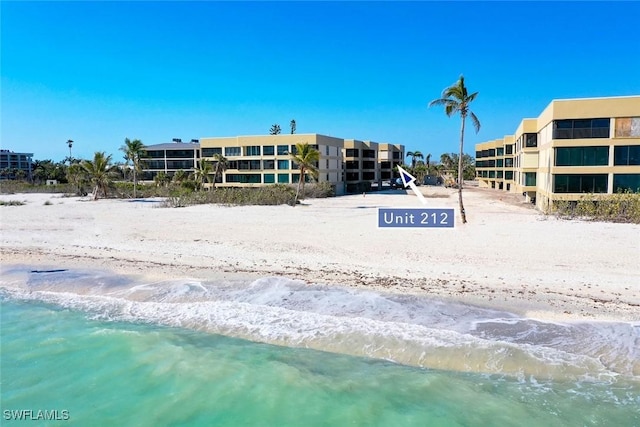 view of home's community featuring a view of the beach and a water view