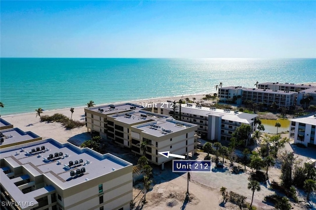 bird's eye view with a view of the beach and a water view